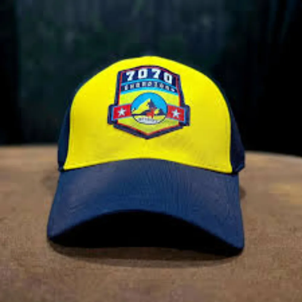 11Sports yellow and navy blue baseball cap with embroidered 7070 crest logo patch on the crown.