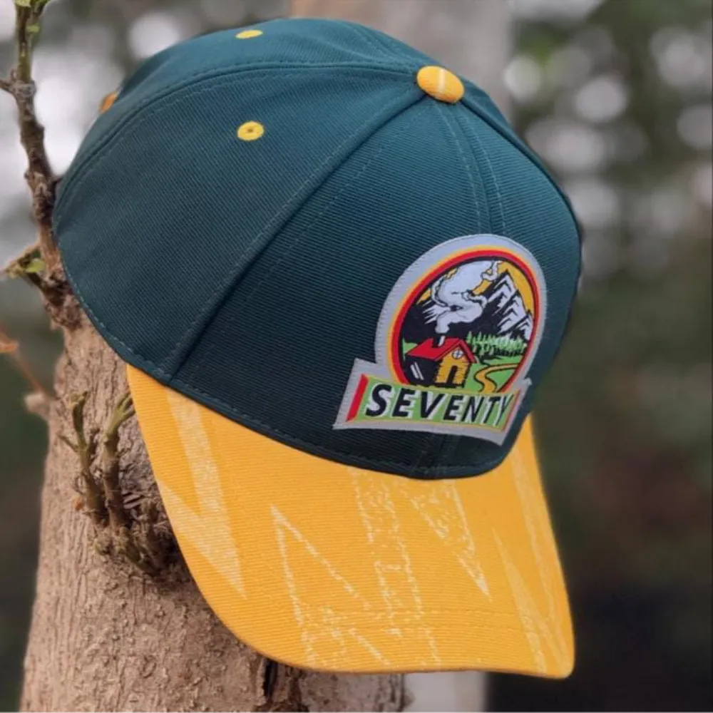 11Sports bold yellow and navy baseball cap featuring the signature 7070 crest logo.