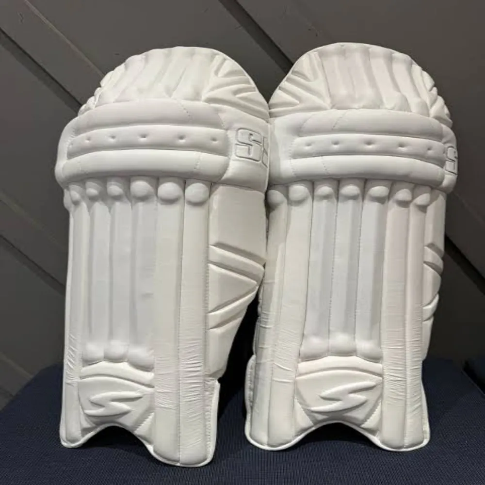 Front view of classic all-white 11Sports professional leather cricket batting pads standing upright.