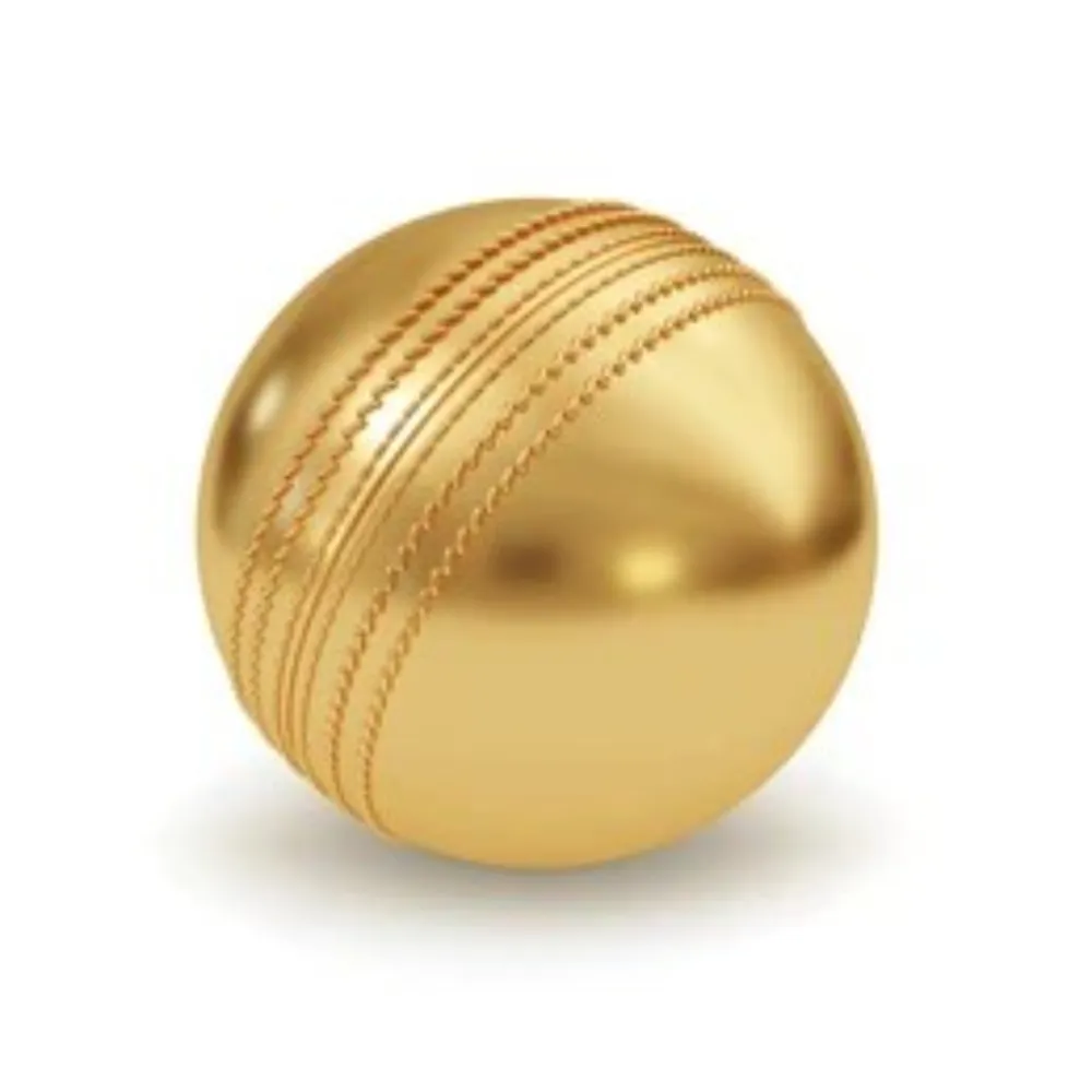 Polished 11Sports metallic gold cricket ball with raised seam on a white background.