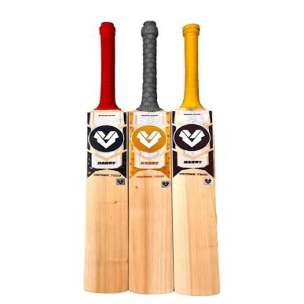 Trio of 11Sports Harry 7500 cricket bats with red, grey, and yellow handles standing side by side.