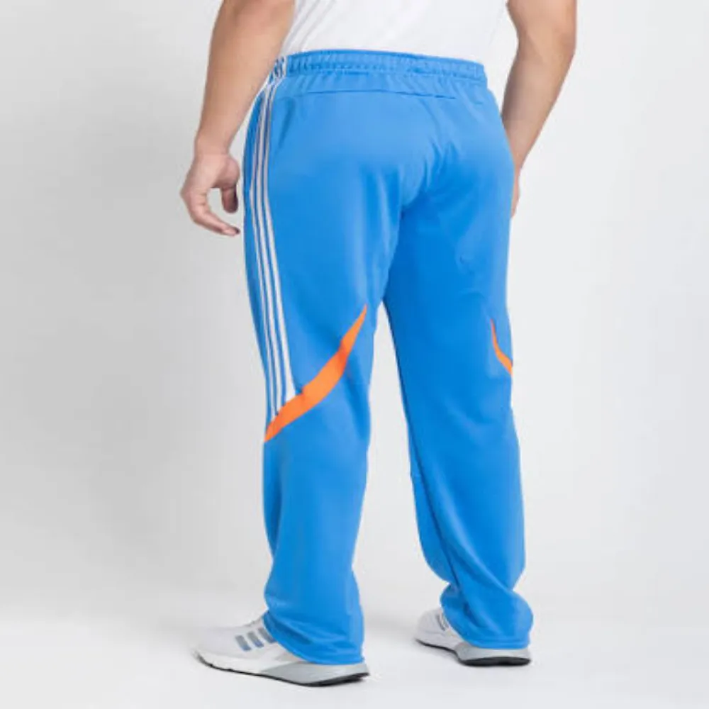 Rear three-quarter view of 11Sports sky blue track pants with white side stripes and bright orange swoosh accents.