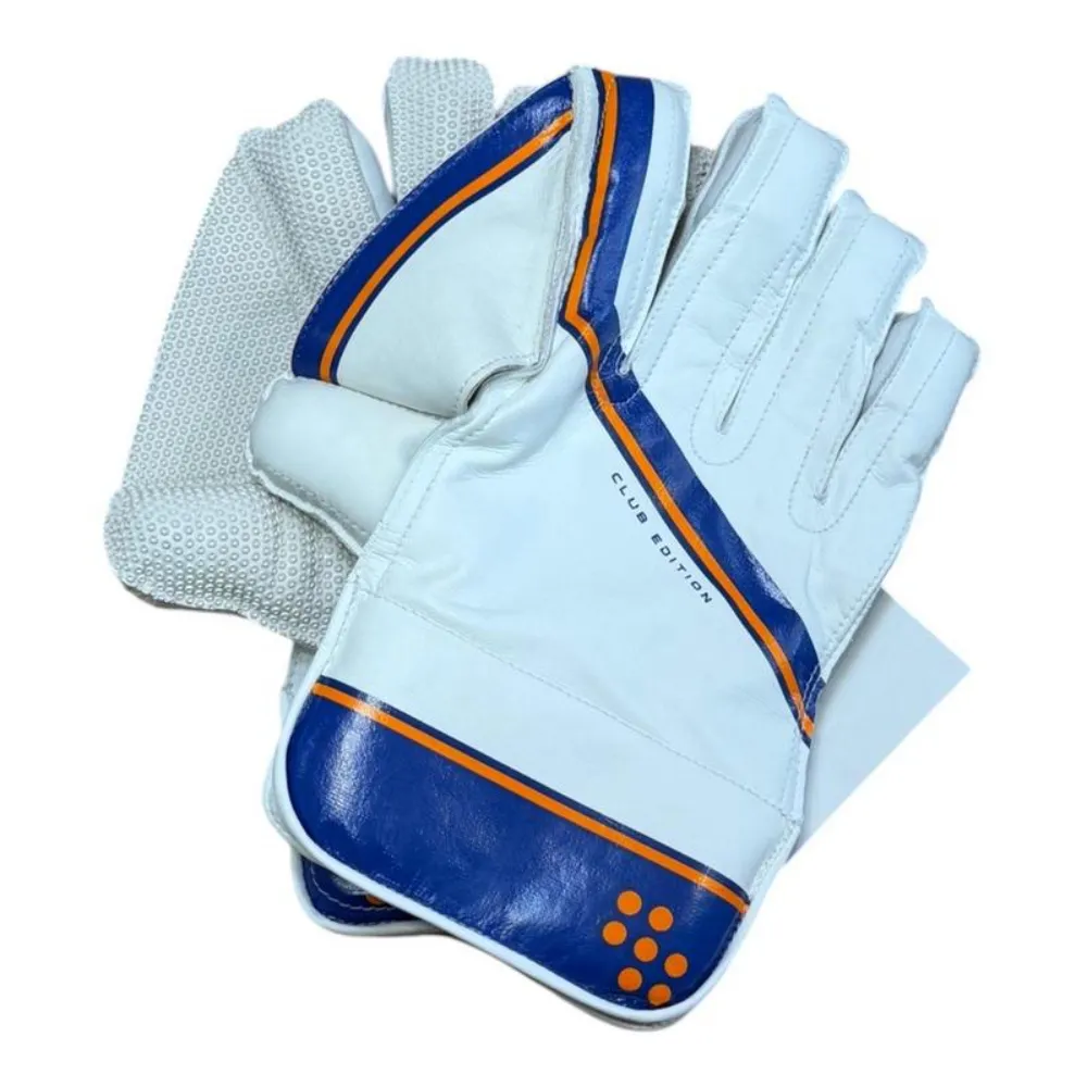 11Sports white and royal blue Club Edition wicket keeping gloves displaying textured rubber palm and padded cuff.