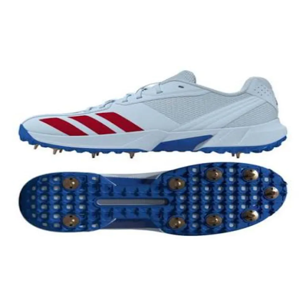 Side and outsole profile of 11Sports white and royal blue cricket bowling shoes with metal spikes.