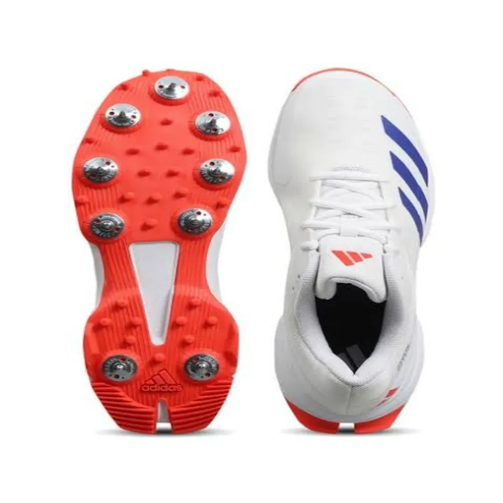 Top view of 11Sports white cricket spikes with blue stripes next to the red-studded metal spike outsole.